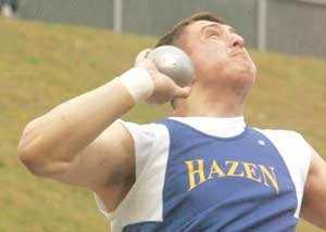 Andrey Levkiv prepares to heave the shot put at the Liberty High School Invitational meet last year.