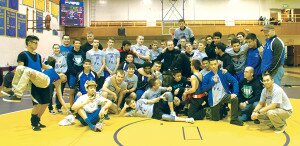 By Rob NicholsHazen High School wrestlers and coaches gather for a group photo after competing in the Taking Down Pancreatic Cancer event to raise funds and awareness for the disease.