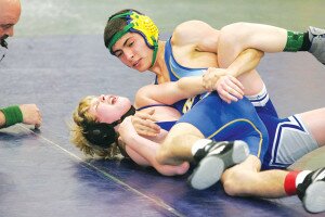 By Greg FarrarAbdu Mukhammadjonov (right), Hazen High School sophomore, is about to have his pin awarded in his 113-pound bout against Liberty freshman Kyle Armstrong during their Jan. 15 match.
