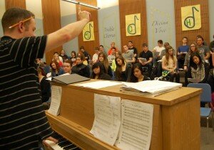 By Christina Corrales-Toy Josh Viles, the chair of the Hazen High School music department, leads the school's concert choir during a March 13 practice.