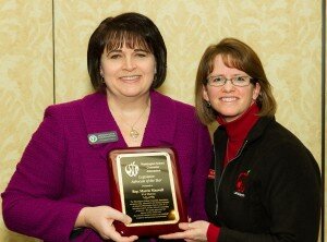 Contributed Olympia High School counselor Kim Reykdal presents Marcie Maxwell with the Washington School Counselor Association’s Legislative Advocate of the Year award.