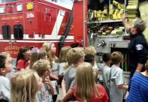 Contributed Hazelwood Elementary School second graders get a tour of Bellevue Fire Department's Station Nine during an exploration of the city.