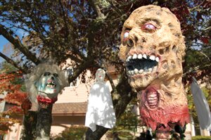 By Christina Corrales-Toy Ghoulish decorations Zombie heads and ghosts hang eerily from a tree in the yard of Kim Alhadeff’s Newcastle home. Her Halloween decorations attract visitors from as far as Auburn and West Seattle. See story, Page11.