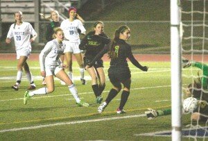 By Greg Farrar Sami Harrell (second from left), Liberty High School junior forward, sees her kick get by Bishop Blanchet’s goalie Nov. 16 for the for the first of her two goals in a 3-0 state 3A soccer tournament win at home. Harrell and teammate Jacquelyn Anderson also scored in their 2-0 win Nov. 13 over Columbia River.