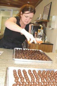 File Sweet Decadence Chocolates owner Sandra Wixon prepares some of her gourmet goods in a 2008 photo.