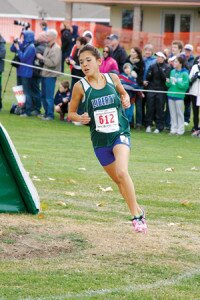 By Mike Smith Brigette Takeuchi, Liberty High School freshman, runs alone on the way to her fourth place finish in her first state championship Nov. 9.