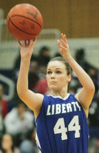 By Greg Farrar Ashlan Applegate, Liberty High School senior forward, throws up three of her 10 points to open the second quarter against Cleveland in their 3A state regional loser-out game March 1.