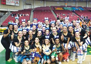 Contributed Hazen High School drill team and coaches show off their newest state championship trophy at the Yakima SunDome March 29. Hazen placed first in 3A pom.