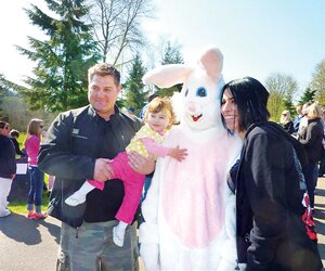 Contributed A Newcastle family poses with the Easter bunny at the 2011 egg hunt. The popular Easter egg hunt returns to the Earth Day lineup this year.