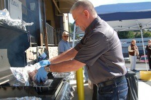 By Christina Corrales-Toy B & E Meats and Seafood owner Jeff Green prepares samples at the store's grand opening in October.