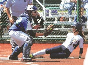 By Greg Farrar Madison O'Connor (left), Liberty High School sophomore catcher, gets Bainbridge baserunner Riley Gregoire out at home plate in the fourth inning on a bases-loaded single, during their 3A state tournament game May 30 in Lacey.