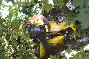 By Greg Farrar A Washington State Patrol trooper looks over a yellow Ducati 749 motorcycle that flew off the eastbound I-90 overpass exit ramp to Highlands Drive, and landed down an embankment off the right shoulder of eastbound Interstate 90.