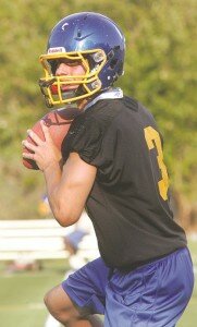 By Greg Farrar Nolan Hoover, Hazen High School senior quarterback, fades back and looks for a receiver August 20 during the Highlanders' first fall football practice of the 2014 campaign.