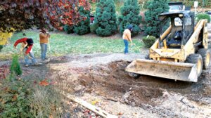 Contributed Workers from Rios Brick Pavers make way for the donation of a new paved patio at Newcastle’s Habitat for Humanity community.