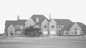 File Scaffolding and landscaping equipment sit in front of the clubhouse March 1999 as opening day approaches for The Golf Club at Newcastle.