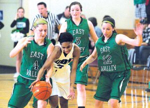 By Greg Farrar Cherelle Demps, Liberty High School senior guard, is fouled by East Valley’s Hannah Burland (4) after stealing the ball from Elle Burland (12), as Jordan Phelan (5) follows the play, during the third quarter of their Feb. 28 Hardwood Classic 2A regional round basketball game.