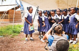 By Martha Adams, provided by GIRL RISING Gina Nemirofsky takes video of a group of school girls in Haiti for the documentary, 'Girl Rising.' The Newcastle Library will host a screening and discussion of the film March 21.