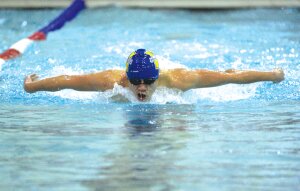 By Greg Farrar Derek Wei, Hazen High School junior, seem to be airborne as he strokes through the water his 100-yard butterfly race, winning in 53.17 seconds Jan. 20 against Liberty.