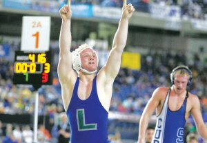 By Greg Farrar Conner Small, Liberty High School senior, exults to his supporters in triumph as he wins the 170-lb. state 2A wrestling championship with a 7-3 win over Sedro Woolley senior Jacob Farrell Feb. 21 during Mat Classic XXVII at the Tacoma Dome.