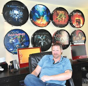 By Christina Corrales-Toy Newcastle resident Steve Kenkman, the brains behind Select A Head drum logo displays, sits in front of his own signed collection of wall-mounted drum displays at his home May 14.