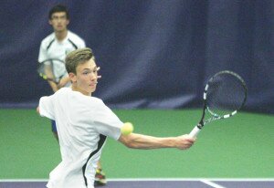 By Greg Farrar Marek Pierepiekarz (left), Liberty High School junior, hits a volley as teammate Matthew Cao, senior, gets ready in the backcourt for a return during their quarterfinal 2A state championship doubles tennis match May 29 at the UW in a 6-0, 6-0 win against Drew Segren and Kevin Smiley of Squalicum.