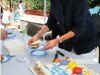 Jill Mason serves a cake commemorating the completion of the new bridge. - By Adam Eschbach
