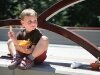 Four-year-old Morgan Ringwood enjoys his mint chocolate chip gelato at the May Creek Bridge ceremony on a hot afternoon. - By Adam Eschbach 