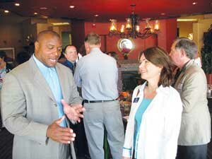 chamber-strong20090600color Former Seattle Seahawk Mack Strong, of Newcastle, discusses the importance of mentoring youngsters with City Councilwoman Lisa Jensen. Contributed