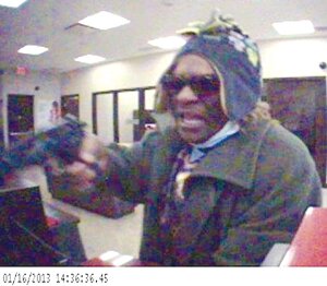 Contributed A suspect robs the Newcastle KeyBank branch at gunpoint Jan. 16.