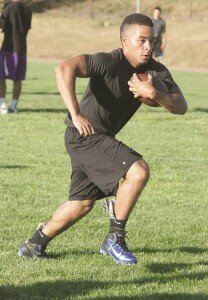 By Greg Farrar Reggie Havard, Hazen High School graduate and running back/defensive back, carries the ball Aug. 6 during a Bellevue Bulldogs junior college football team drill.