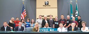 Contributed Students and faculty from Liberty High School join the Metropolitan King County Council after the council unanimously approved legislation changing the name of the street in front of the school to Patriot Way.