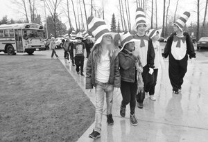  A weeklong Seussical Celebration got under way Feb. 24 at Apollo Elementary School, as student council members led by (from left) Jessica Tomlinson, Lauren Pizarro, Sam Nelson and Alex Boster, and school librarian Carol Fujioka, return to class after greeting the kindergarten bus wearing Cat in the Hat accessories. Part of the nationwide Read Across America, the highlight of the week’s activities is a Read-In the evening of Feb. 27, with high school volunteer readers, cookies and optional pajamas. Dr. Seuss’ birthday is March 2. By Greg Farrar