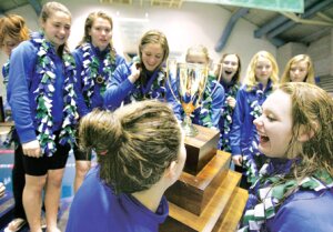 By Greg Farrar The trophy looks awesome up close for the Liberty High School swim team as they celebrate their school's first-ever state swim team championship Nov. 15 at the King County Aquatic Center, earned in style with a 2A-record 348 point total.