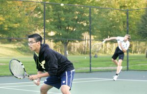 By Greg Farrar Matthew Cao (left), Liberty High School senior, is set for the return as his teammate, junior Marek Pierepiekarz, serves during their doubles match Oct. 16 against Interlake at Tibbetts Valley Park. Cao and Pierepiekarz won the District 3 2A tournament Nov. 1 in Bremerton and will compete for the state championship in May.