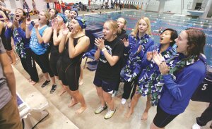 By Greg Farrar The Liberty High School swim team cheers Nov. 15 as the 400-yard freestyle relay team wins the final event and the Patriots run away with their first-ever team state swimming championship.