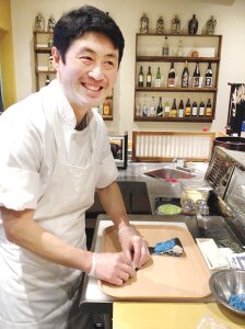 Contributed Newcastle resident Harutaka Imai crafts his signature Seahawks sushi roll at Miyabi Sushi in Tukwila. It takes Imai 30 minutes to make one roll. Imai moved to Newcastle with his wife six years ago. They came to the United States from Japan, where Imai also worked as a sushi chef.