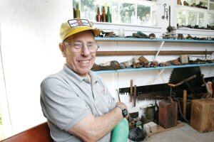 By Greg Farrar Milt Swanson, recalling the happiness and the hardship of a lifetime lived in Newcastle, poses in a 2012 photo, sitting among the artifacts of local history that he had collected and stored in a makeshift museum building on his property.