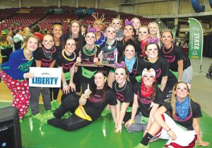 Contributed The Liberty High School drill team surrounds its new hardware after winning two state titles at the 2015 state championship March 27 at the Yakima Valley SunDome.