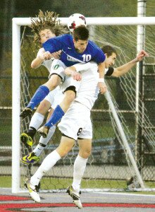 By Greg Farrar Colton Ronk (10), Liberty High School senior midfielder in 2014, contends for the ball against Colton Oord (left) and Aaron Baumgardner, of Mount Si, in front of the Wildcats goal during a soccer match.